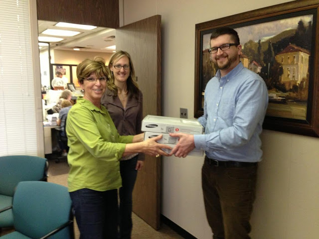 Chromebooks being delivered to Macomb County Clerk / Register of Deeds Carmella Sabaugh and Administrative Assistant Crystal Brenner by Michael Jefferies.